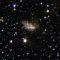 銀河どうしの合体で大きく変形した銀河ESO 99-4